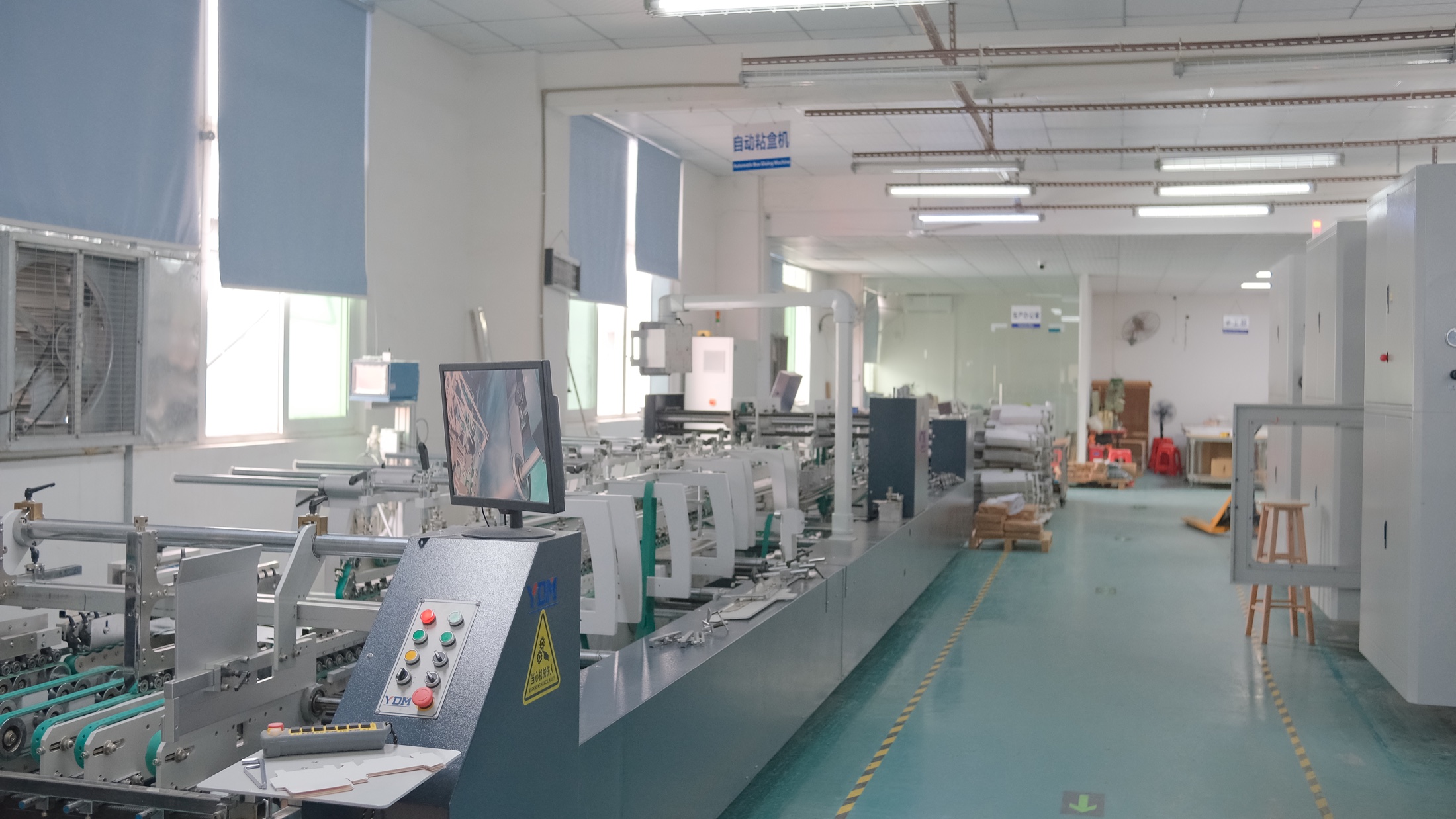 Premium rigid box assembly line in the packaging workshop